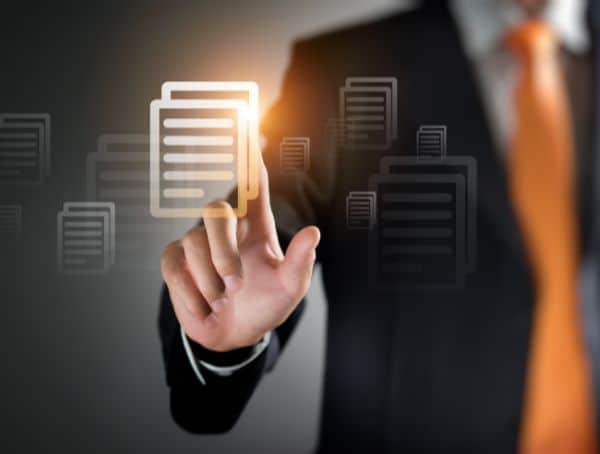 Businessman interacting with digital documents