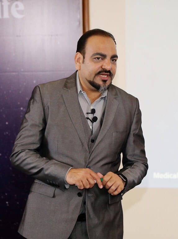 Man in suit giving presentation