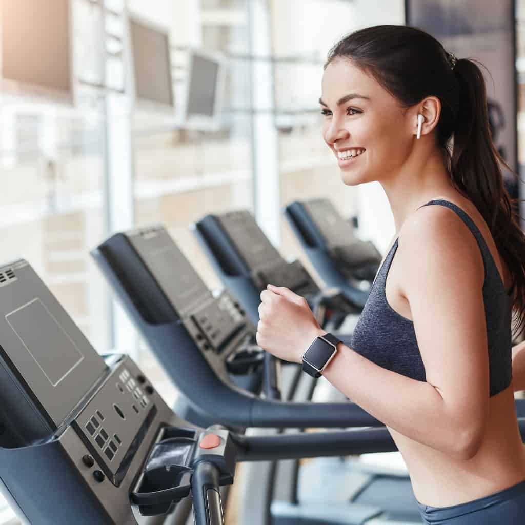get-faster-side-view-of-young-and-cheerful-woman-in-sportswear-is-on-picture-id1146476128.jpg
