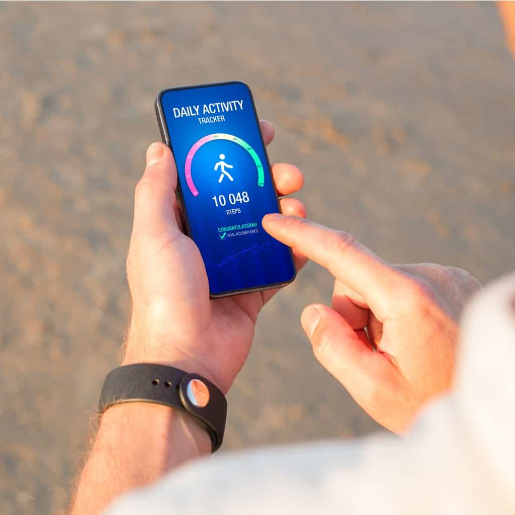 man-using-daily-activity-tracking-app-on-mobile-phone-showing-10-000-picture-id1324038732.jpg