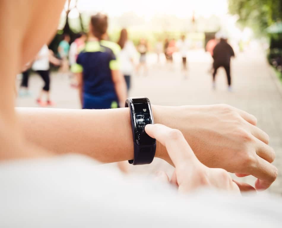 woman-checking-heart-rate-exercise-workout-fitness-smart-watch-picture-id615414964.jpg